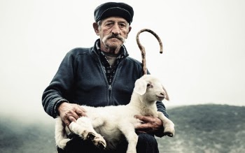 Man Carrying Lamb