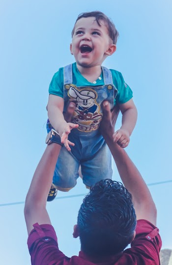 Man Carrying Toddler