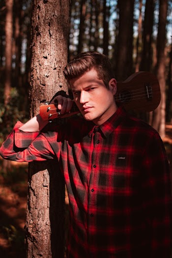 Man Carrying Ukulele