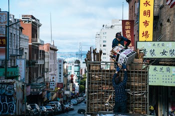 Man Carrying White Box