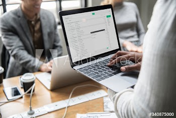 Man checking his email on a laptop