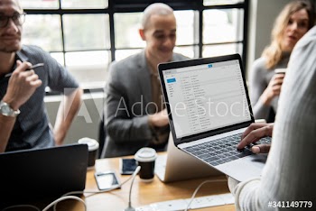 Man checking his email on a laptop