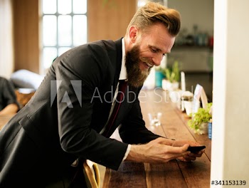 Man chilling out at coffee shop with mobile phone