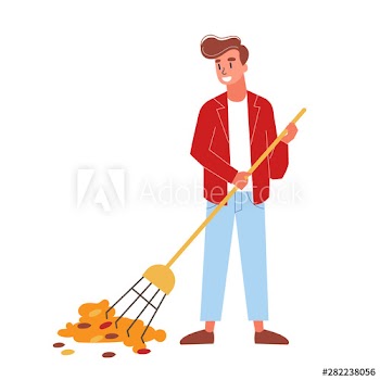 Man collecting dry leaves in autumn