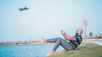 Man Controlling Quadcopter Drone