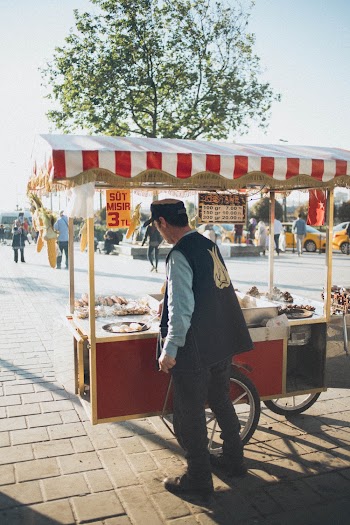 Man Cooking On Portable Food Stall