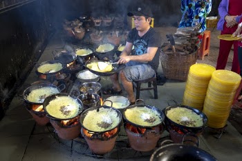 Man Cooking While Sitting
