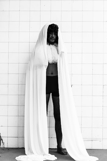 Man Covering Head With White Cloth
