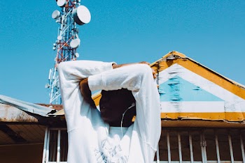 Man Covering His Face