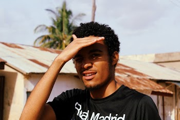 Man Covering His Face With His Right Hand