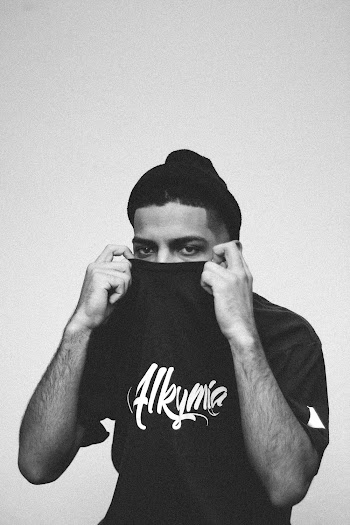Man Covering His Face With His Shirt