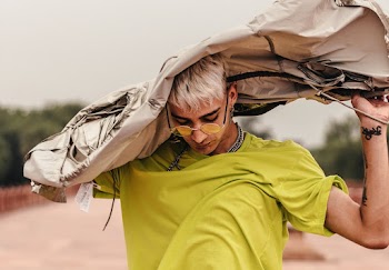Man Covering His Head With Jacket