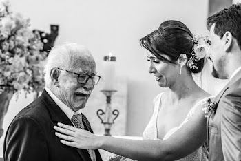 Man Crying in Front of Newly Wed Couple