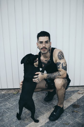 Man Cuddling Dog