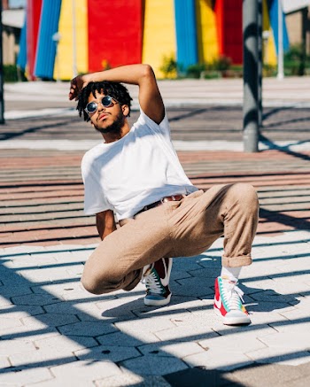 Man Dancing on Pavement