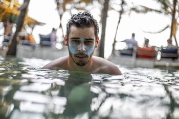 Man Dipped in a Swimming Pool