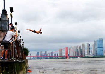Man Diving on Body of Water