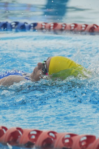Man Doing Back Stroke Swimming