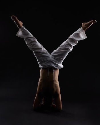 man doing head stand
