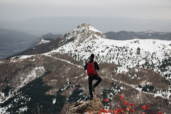Man Doing One-leg Standing Post on Cliff