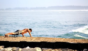 Man Doing Push Up on the Seashore