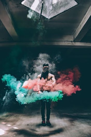 man doing smoke tricks