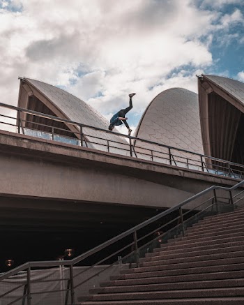 Man Doing Stunt on Rail