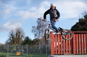 Man Doing Tricks on His Black Bmx
