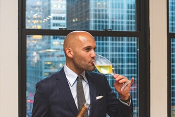 Man Drinking Liquor from Wine Glass
