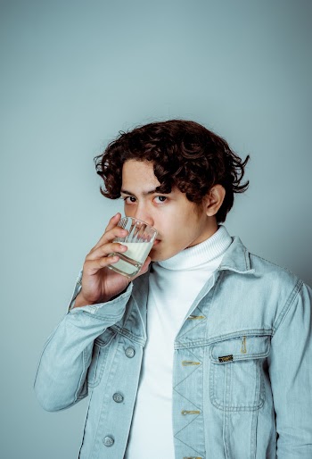 Man Drinking Milk from Glass