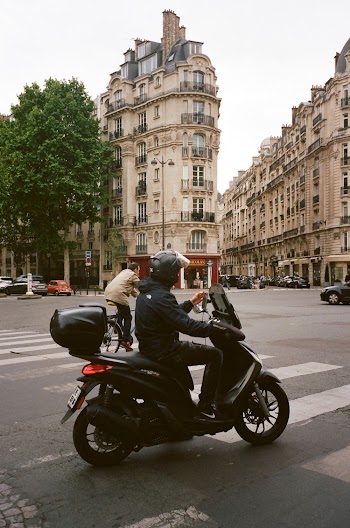 Man Driving Motor Scooter 