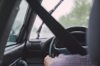 Man driving on a rainy day