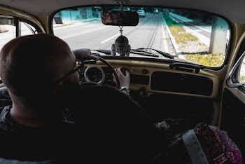 Man Driving Vehicle Close-up Photography