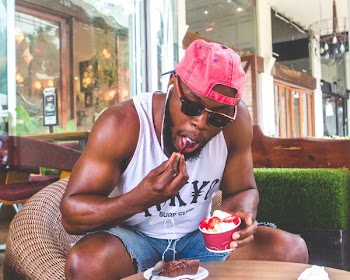 Man Eating Froyo With Strawberries