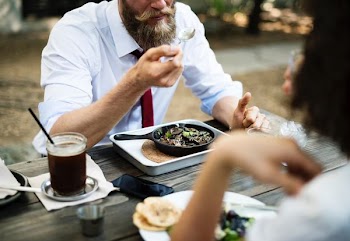 man eating on dish served on pan