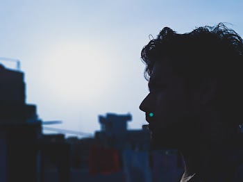Man Face With a Background of Buildings