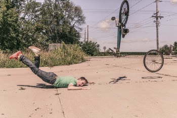 Man Falling Off Bike Free Photo 