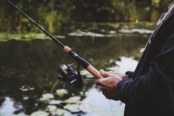 Man Fishing At Lake