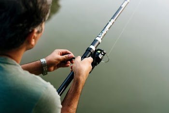 man fishing closeup photography