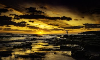 Man Fishing During Golden Hour
