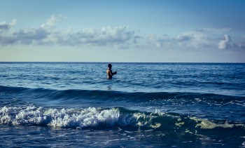 Man Fishing on Body of Water