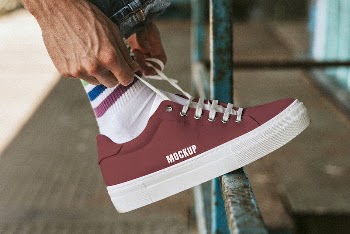 Man fixing shoelaces on red | Free PSD Mockup - rawpixel