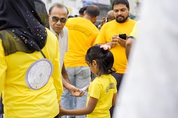 Man Giving A Child A Candy