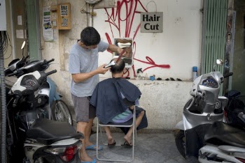 Man Giving a Haircut 