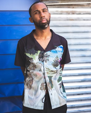 Man Glaring With Both Hands Behind His Back