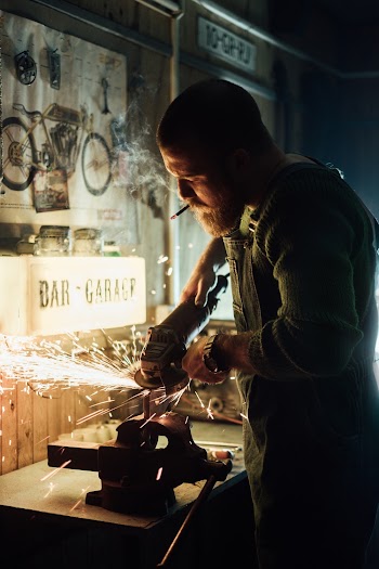 Man Grinding Metal