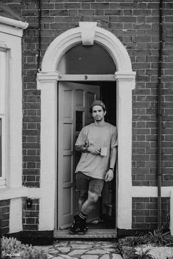 Man having his morning coffee by the doorway of his house during the c.. | Free  photo - 2332463
