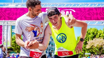 Man Helping A Tired Runner