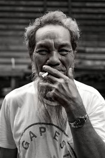 man hit cigarette