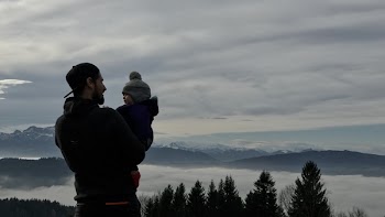 Man Holding a Baby Photo